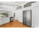 Updated kitchen featuring stainless steel appliances and white cabinets at 3806 Doune Way, Clermont, FL 34711