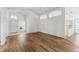 Open living room with wood-look floors and access to the outdoors at 3806 Doune Way, Clermont, FL 34711
