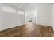 Bright living room with vaulted ceilings and wood-look floors at 3806 Doune Way, Clermont, FL 34711