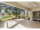 Bright screened porch with view of the backyard and golf course at 3806 Doune Way, Clermont, FL 34711