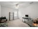 Bedroom with desk, shelving, and window with plantation shutters at 4056 Venetian Ln, The Villages, FL 32163
