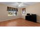 Bright bedroom with large window and hardwood floors at 546 Foxfield Path, The Villages, FL 32162