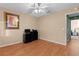 Bright bedroom with wood floors and ceiling fan at 546 Foxfield Path, The Villages, FL 32162