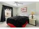Bedroom featuring a ceiling fan, bright window, and comfortable bed at 546 Foxfield Path, The Villages, FL 32162