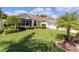 House exterior with well-manicured lawn at 546 Foxfield Path, The Villages, FL 32162
