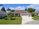Attractive single-story home with two-car garage and driveway at 546 Foxfield Path, The Villages, FL 32162