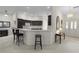 A well-lit kitchen with counter seating and an open layout, perfect for entertaining and casual dining at 546 Foxfield Path, The Villages, FL 32162