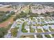 Aerial view of a residential neighborhood with golf course nearby at 603 San Pedro Dr, Lady Lake, FL 32159