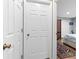 Hallway leading to bedroom featuring a glimpse of the bedroom's layout and decor at 603 San Pedro Dr, Lady Lake, FL 32159