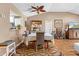 Charming dining room with hardwood floors and a view of the living room at 603 San Pedro Dr, Lady Lake, FL 32159