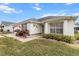 One-story home with attached garage and landscaped front yard at 603 San Pedro Dr, Lady Lake, FL 32159