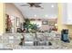 Kitchen with granite countertops and view into living room at 603 San Pedro Dr, Lady Lake, FL 32159