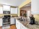 Kitchen features stainless steel appliances and granite countertops at 603 San Pedro Dr, Lady Lake, FL 32159