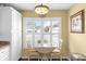 Kitchen nook with white cabinets and a round table at 603 San Pedro Dr, Lady Lake, FL 32159