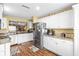 Bright kitchen with stainless steel appliances and granite countertops at 603 San Pedro Dr, Lady Lake, FL 32159