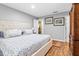 Bright bedroom with a spacious layout, wood floors, and ensuite bathroom access at 603 San Pedro Dr, Lady Lake, FL 32159
