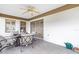 Spacious screened porch with patio furniture and ceiling fan at 603 San Pedro Dr, Lady Lake, FL 32159