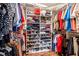 Organized walk-in closet with shelving for clothes, shoes, and accessories at 603 San Pedro Dr, Lady Lake, FL 32159