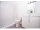 Modern bathroom with white cabinets, marble shower, and pebble floor at Lot 17 Indian Estates Cr 423, Lake Panasoffkee, FL 33538
