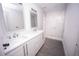 Elegant bathroom featuring dual vanity, marble shower, and gray floor at Lot 17 Indian Estates Cr 423, Lake Panasoffkee, FL 33538