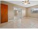 Bedroom with sliding glass doors and tiled floors at 1033 Shore Acres Rd, Mount Dora, FL 32757