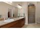 Double vanity bathroom with a large walk-in shower at 11038 Se 170Th Lane Rd, Summerfield, FL 34491