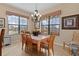 Bright dining area with large windows and a six-person table at 11038 Se 170Th Lane Rd, Summerfield, FL 34491