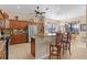 Open concept kitchen with granite countertops and breakfast bar at 11038 Se 170Th Lane Rd, Summerfield, FL 34491