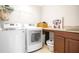 Laundry room with washer, dryer, and countertop at 11331 Little Nellie Dr, Clermont, FL 34711