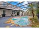 Relaxing screened pool with stonework and patio at 11331 Little Nellie Dr, Clermont, FL 34711