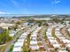 Aerial view of a large 55+ community near the water at 1559 Nassau Cir, Tavares, FL 32778