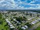 Aerial view showing community of mobile homes near lake at 1559 Nassau Cir, Tavares, FL 32778