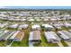 Aerial view of a 55+ community showcasing various homes at 1559 Nassau Cir, Tavares, FL 32778