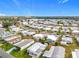 Aerial view of a 55+ community by the lake at 1559 Nassau Cir, Tavares, FL 32778