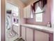 Clean bathroom with lavender walls, shower, and vanity at 1559 Nassau Cir, Tavares, FL 32778