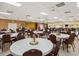 Large community room with tables and chairs for events at 1559 Nassau Cir, Tavares, FL 32778
