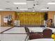 Community room with stage, tables, and chairs at 1559 Nassau Cir, Tavares, FL 32778