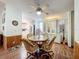 Casual dining area with wood-look floors and kitchen views at 1559 Nassau Cir, Tavares, FL 32778
