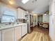 Kitchen with stainless steel appliances and light wood flooring at 1559 Nassau Cir, Tavares, FL 32778
