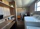 Laundry room with washer, dryer, and shelving at 1559 Nassau Cir, Tavares, FL 32778