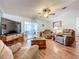 Comfortable living room with large TV and lots of natural light at 1559 Nassau Cir, Tavares, FL 32778