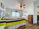 Spacious main bedroom with wood-look floors and large windows at 1559 Nassau Cir, Tavares, FL 32778