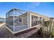 Backyard with screened patio and stone pathway at 17113 Se 78Th Larchmont Ct, The Villages, FL 32162