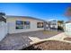 Backyard with stone patio and screened enclosure at 17113 Se 78Th Larchmont Ct, The Villages, FL 32162