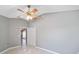 Bedroom with ceiling fan and access to another room at 17113 Se 78Th Larchmont Ct, The Villages, FL 32162