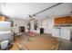 Garage with washer, dryer, water heater, and storage cabinets at 17113 Se 78Th Larchmont Ct, The Villages, FL 32162