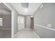 Interior hallway with neutral walls and tile flooring at 17113 Se 78Th Larchmont Ct, The Villages, FL 32162