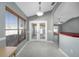 Kitchen with wood cabinets and view into the adjacent living area at 17113 Se 78Th Larchmont Ct, The Villages, FL 32162