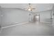 Spacious living room with tile floors and access to other rooms at 17113 Se 78Th Larchmont Ct, The Villages, FL 32162