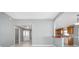 Open living room and kitchen area with a breakfast bar at 17113 Se 78Th Larchmont Ct, The Villages, FL 32162